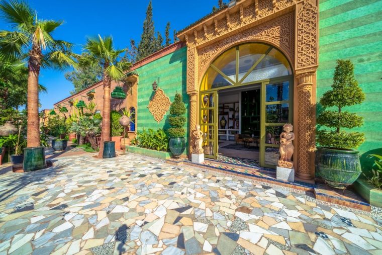 The entrance courtyard, carved doors and mosaic paving