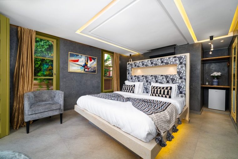 Contemporary bedroom in grey and warm wood