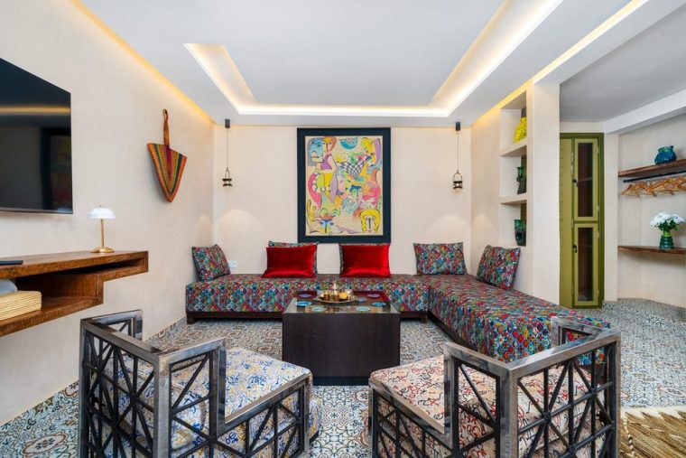 Salon of a suite with patterned banquettes