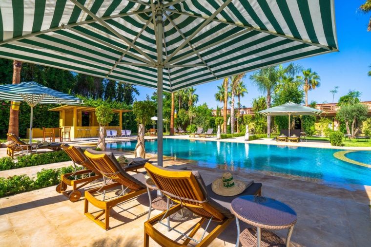 Loungers and parasols along the water's edge