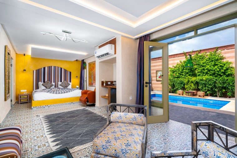 Bedroom opening directly onto its private pool