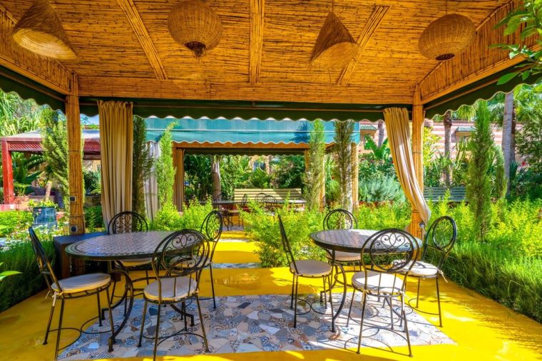 The cedar pergola with low banquettes