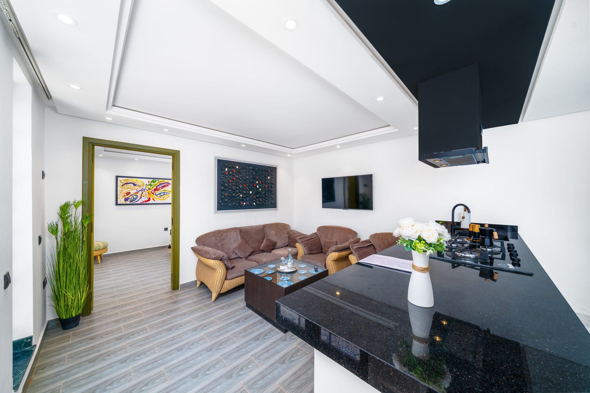 Living room and open kitchen of the family apartment at Jnane Rihane
