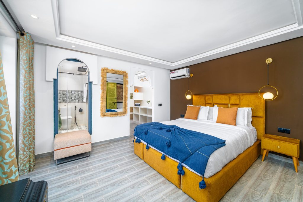Bedroom of the family apartment with a carved headboard