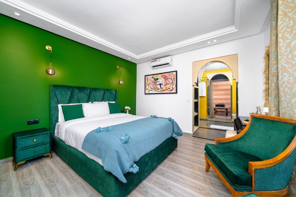 Emerald bedroom of the family apartment with its own armchair