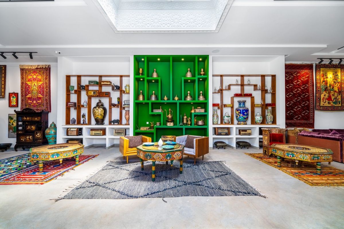 Moroccan ceramics and brass displayed on the shelves of the collection