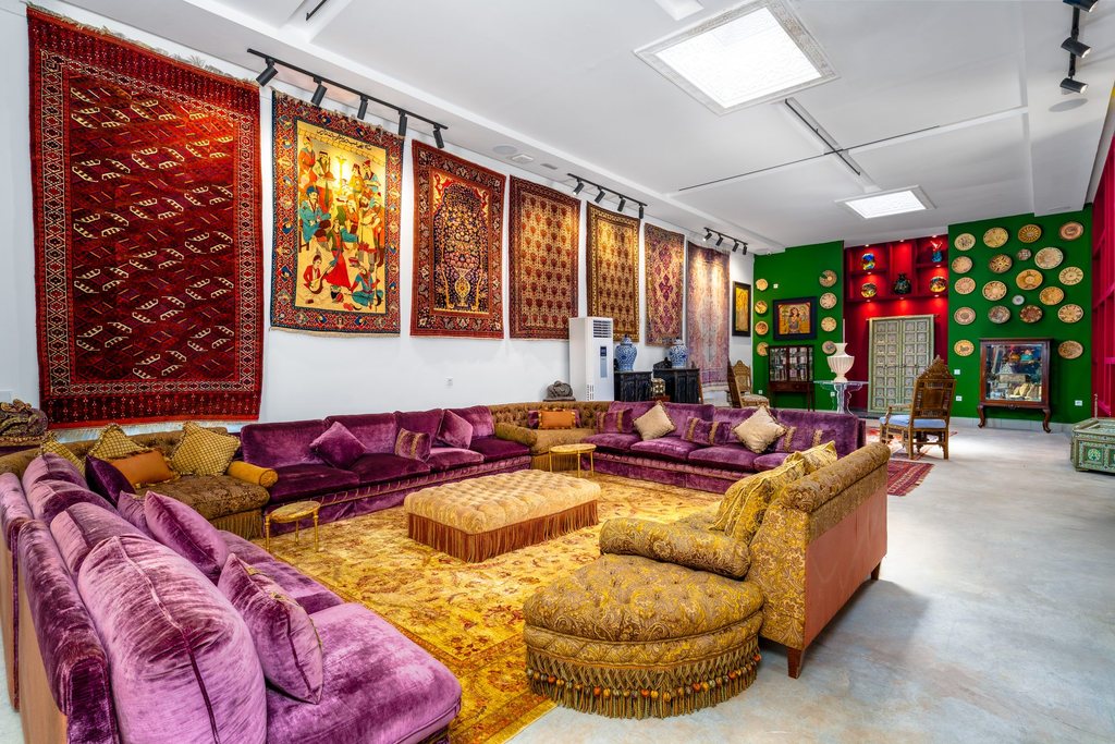 Velvet banquettes and gilded seating in the collection gallery
