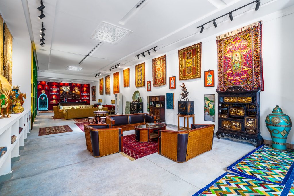 Antique furniture and hanging carpets in the family collection