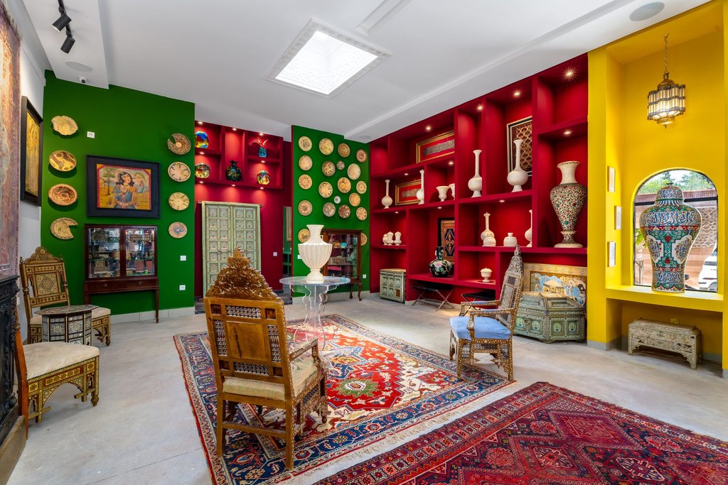 Carved chairs and a Berber rug at the heart of the collection