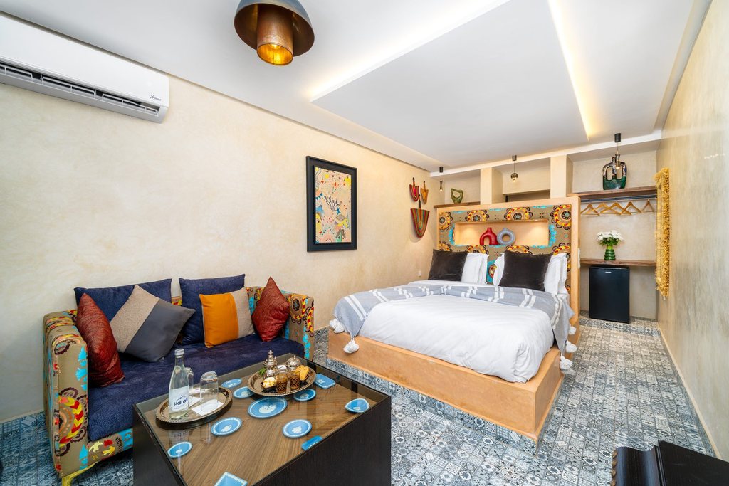 Deluxe room with a sitting corner and a low tea table