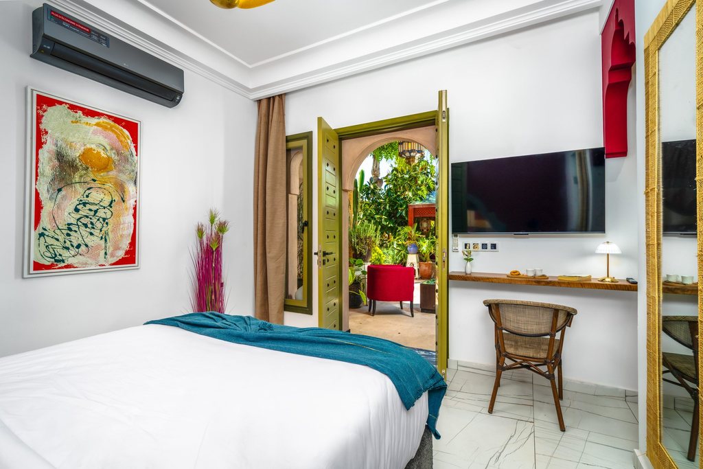 Standard room looking out to the palms through open doors
