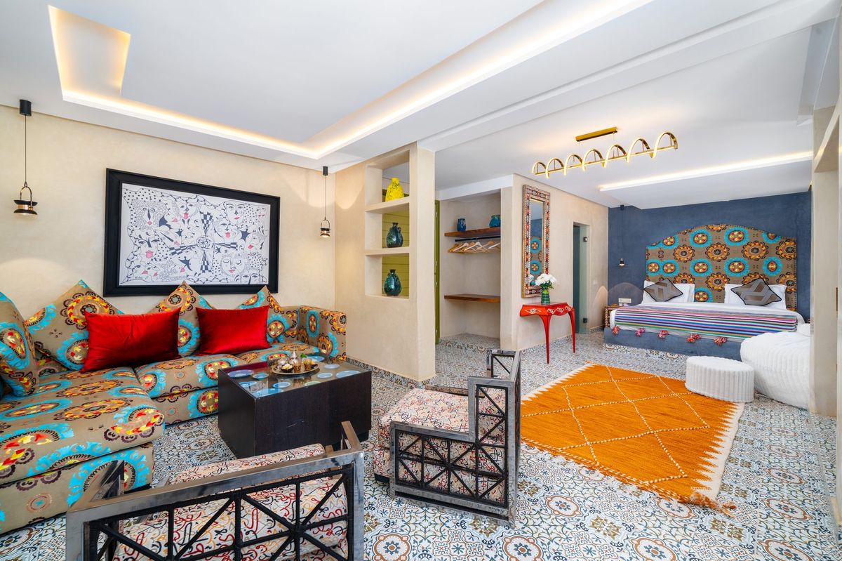 Moroccan salon of a suite with patterned banquettes and a low table