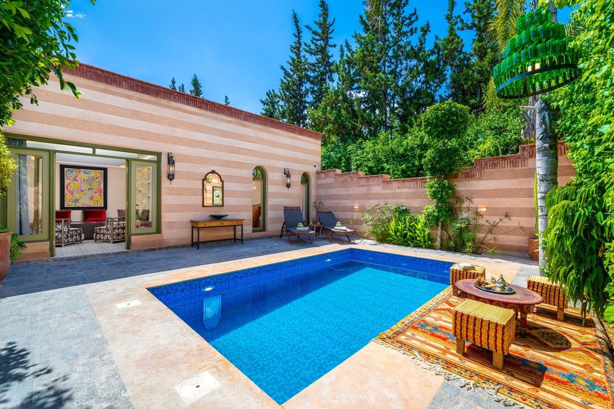 Terrace and private pool of a suite, loungers in the shade