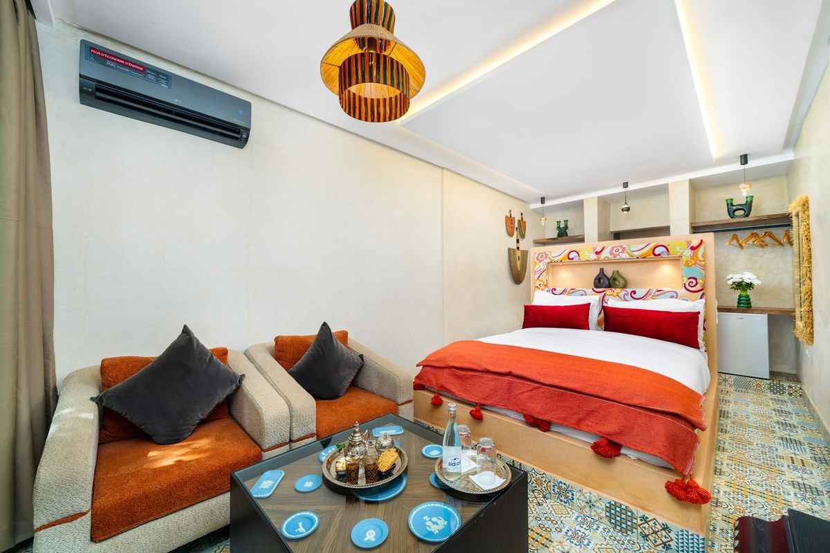 Deluxe room with a banquette and a low table laid for mint tea