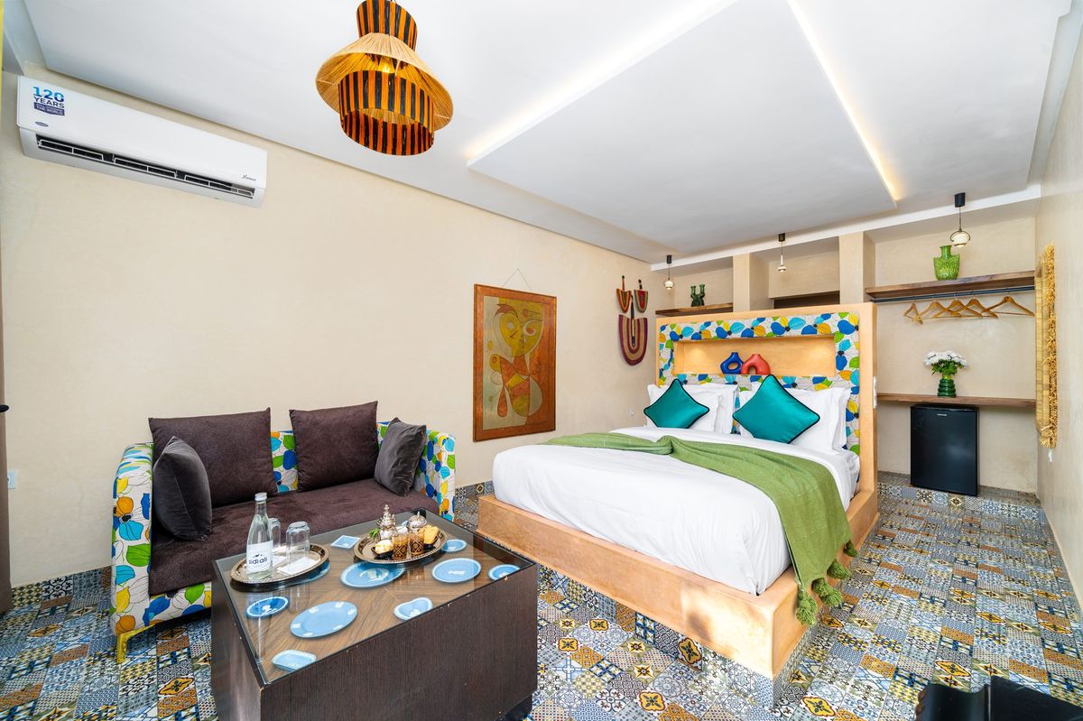 Deluxe room with its own salon corner beside the bed